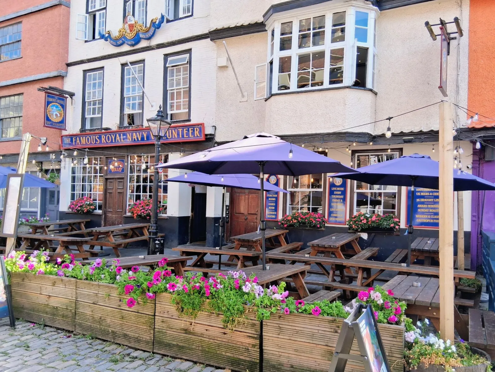 Flower-filled outdoor tables outside The Volley on King Street, from the CAMRA gallery